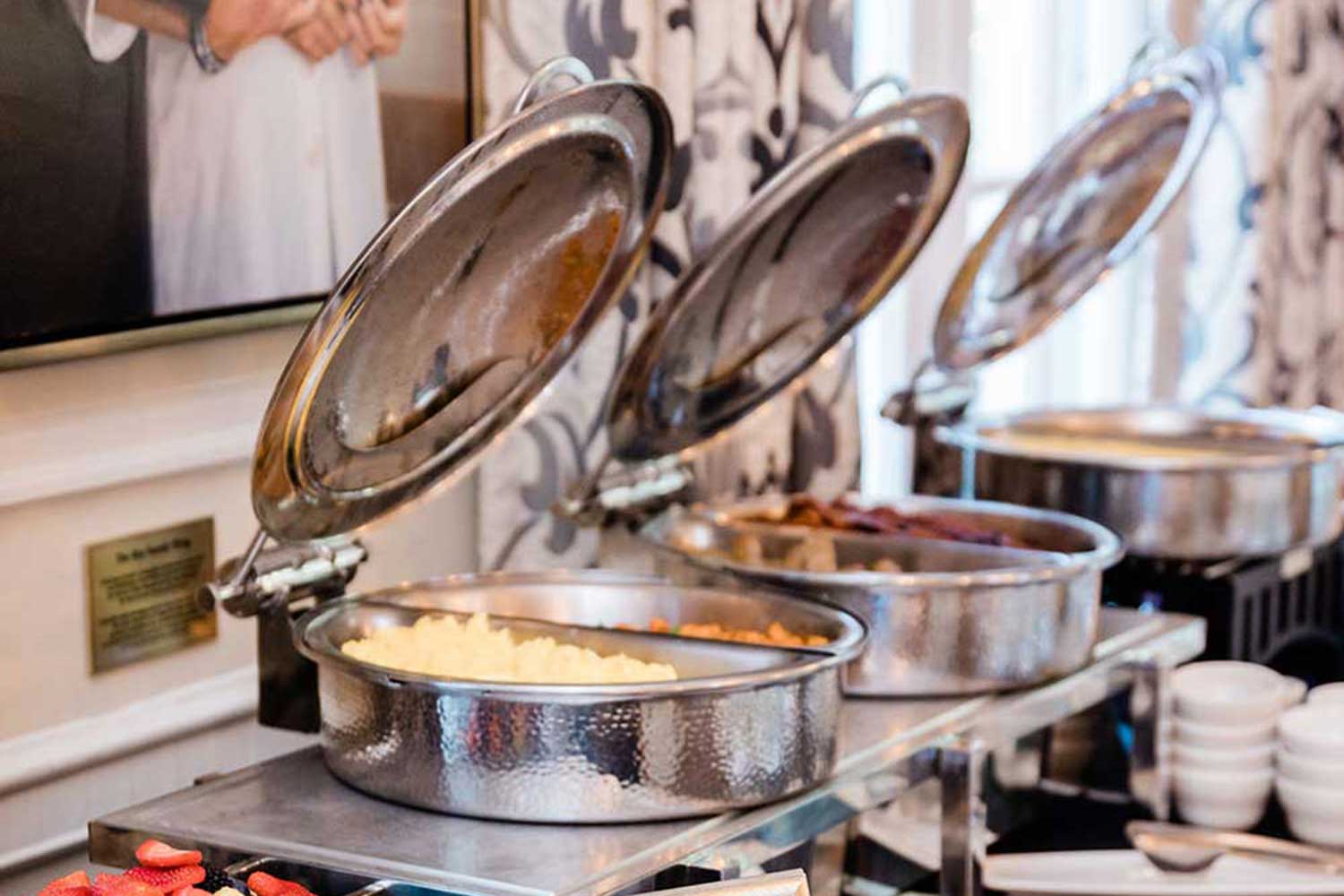 A buffet with several chafing dishes
